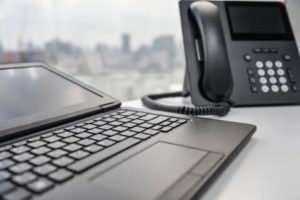 picture of VoIP Phone and Laptop