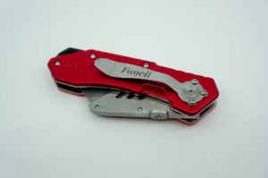 FC folding utility knife, folded showing compact form and large belt clip
