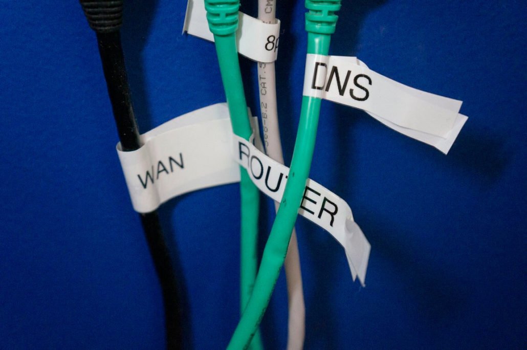 labeled patch cables connected to network firewall